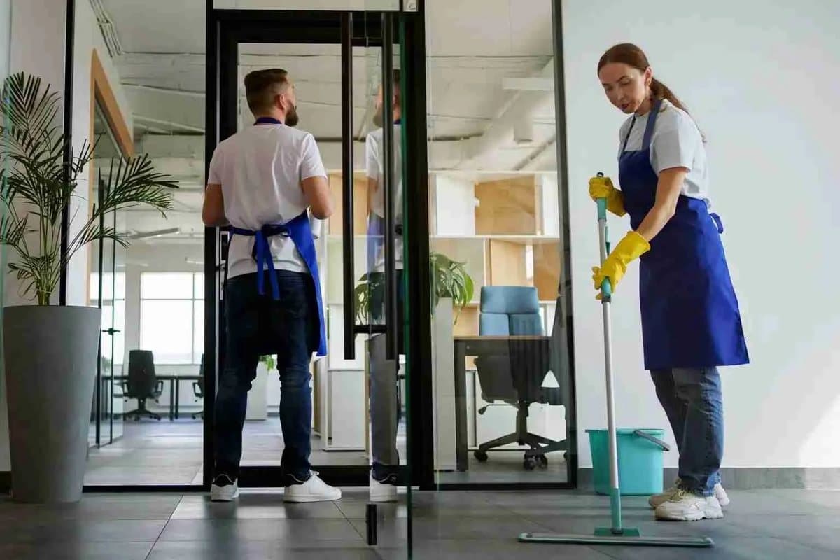 A Clear Choice team member arriving at a doorway with cleaning equipment, ready to start.
