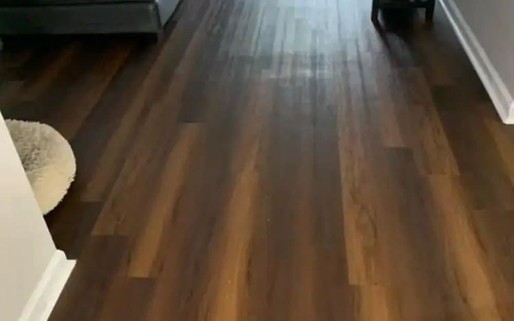 Freshly cleaned hardwood floor in an emptied room, ready for the final walkthrough.